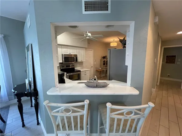a kitchen with a table and chairs in it