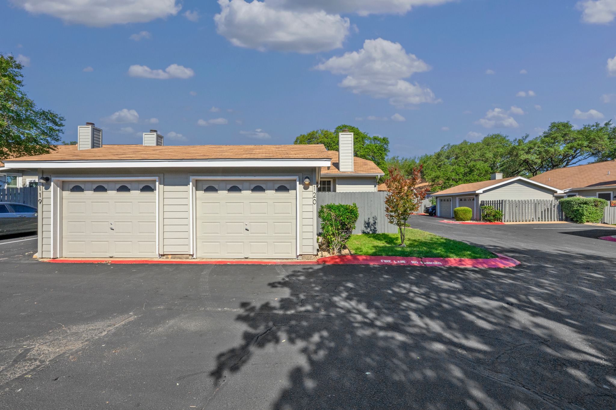 6501 Brush Country Road, Unit 120 Austin, TX 78749 - Photo 25 of 26 Property exterior featuring a one car garage.