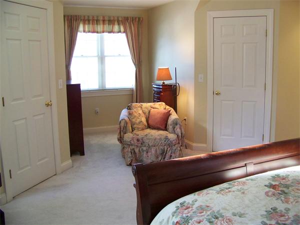75 Nixon Road Framingham, MA 01701 - Photo 15 of 26 a living room with a bed and a window