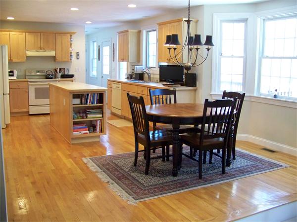 75 Nixon Road Framingham, MA 01701 - Photo 3 of 26 a view of a dining room with furniture and a wooden floor