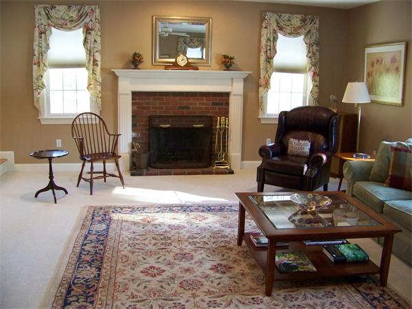 75 Nixon Road Framingham, MA 01701 - Photo 6 of 26 a living room with furniture and a fireplace