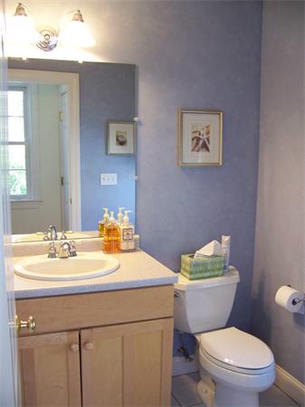 75 Nixon Road Framingham, MA 01701 - Photo 9 of 26 a bathroom with a sink a toilet and a mirror