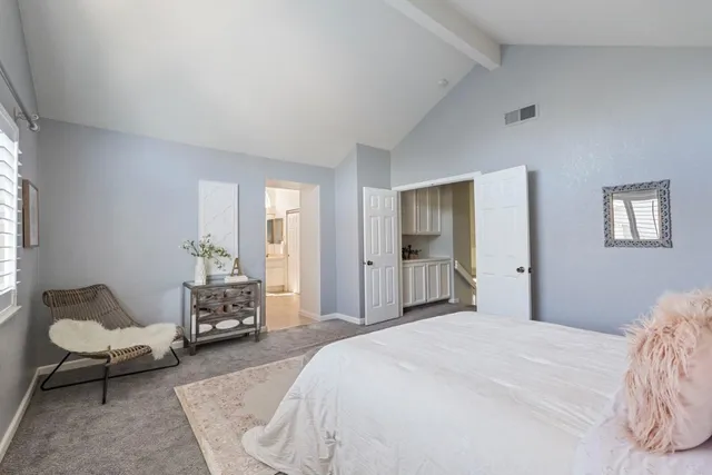 a bedroom with a bed and window