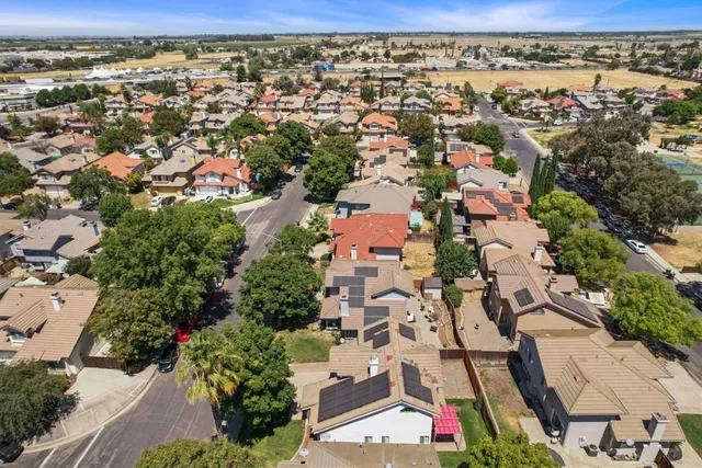 an aerial view of residential houses with outdoor space