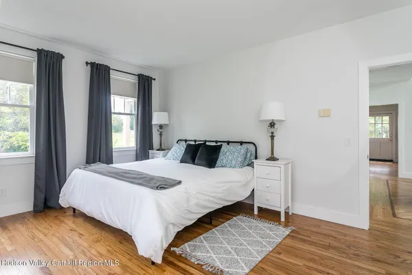 a bedroom with a bed and window