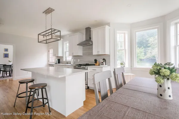 a very nice looking dining room with a table and chairs