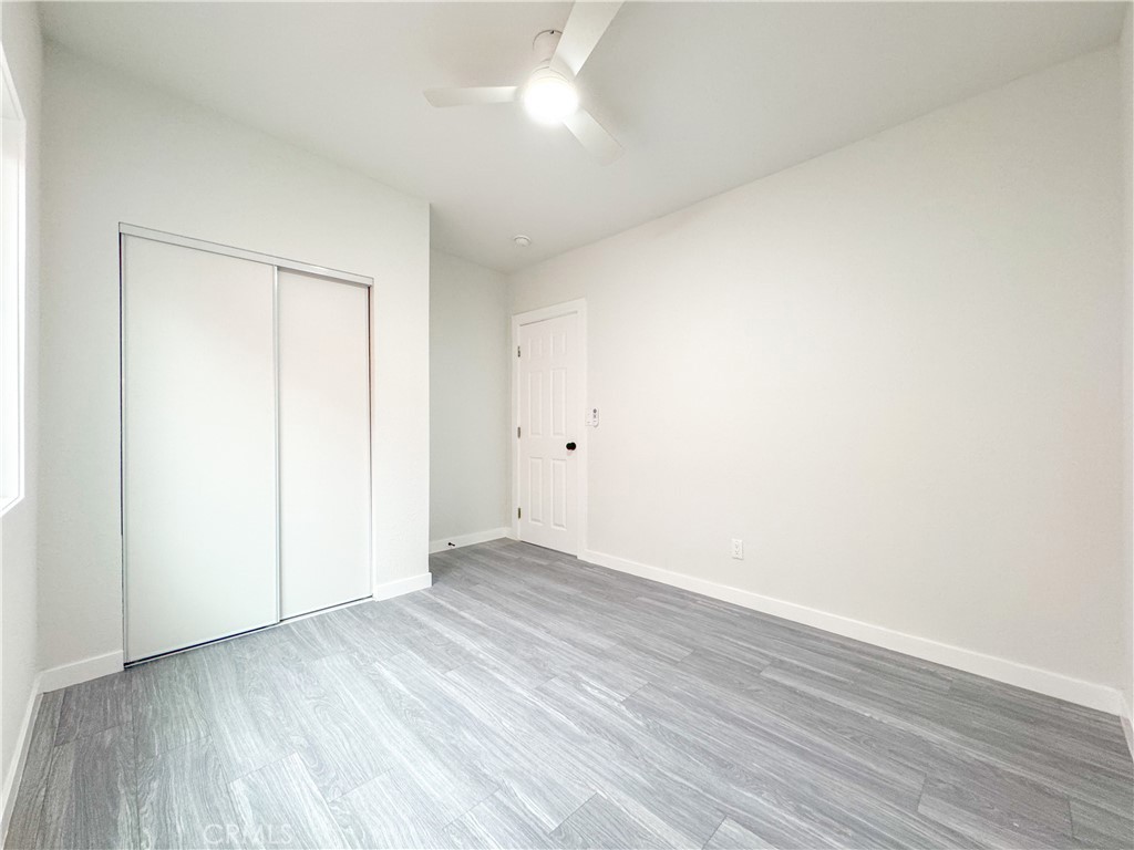 1366 West 152nd Street Compton, CA 90220 - Photo 21 of 30 an empty room with wooden floor