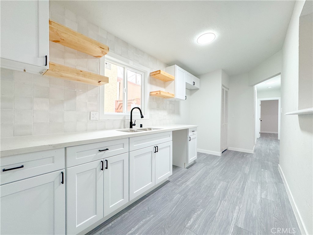 1366 West 152nd Street Compton, CA 90220 - Photo 6 of 30 a spacious bathroom with a double vanity sink and mirror