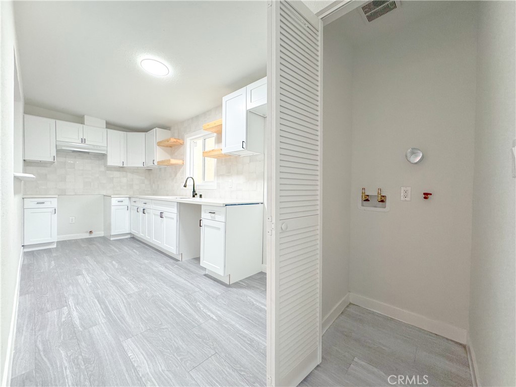 1366 West 152nd Street Compton, CA 90220 - Photo 7 of 30 a view of kitchen with wooden floor