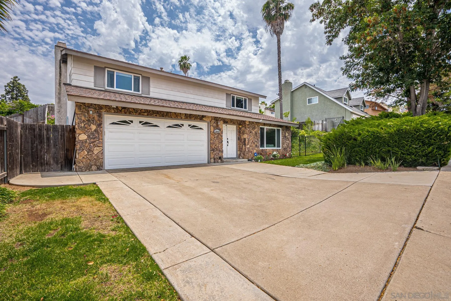 10046 Fieldcrest Street Spring Valley, CA 91977 - Photo 1 of 42 a front view of a house with a yard