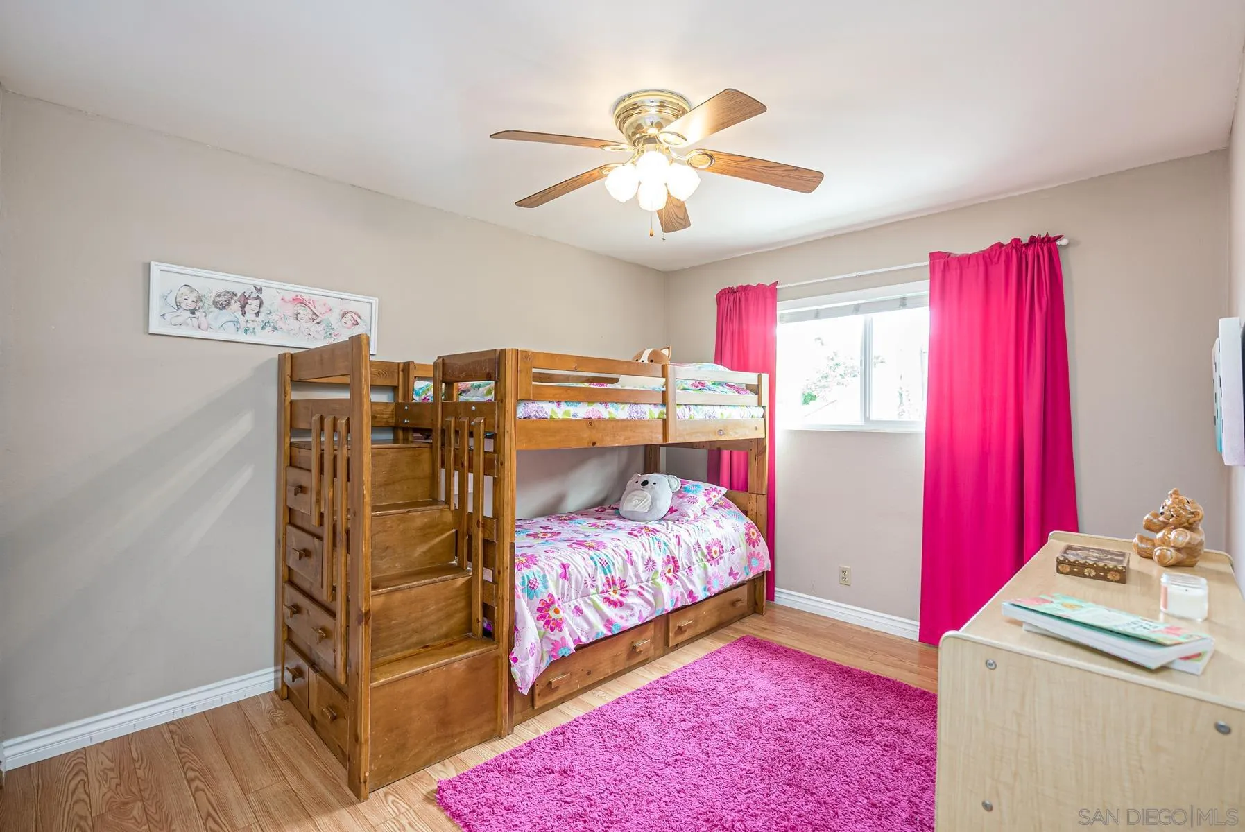 10046 Fieldcrest Street Spring Valley, CA 91977 - Photo 23 of 42 a bedroom with a bed and a chandelier