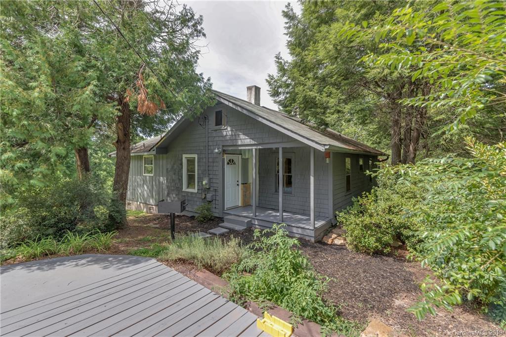 265 Carson Street Tryon, NC 28782 - Photo 1 of 28 a front view of house with a garden