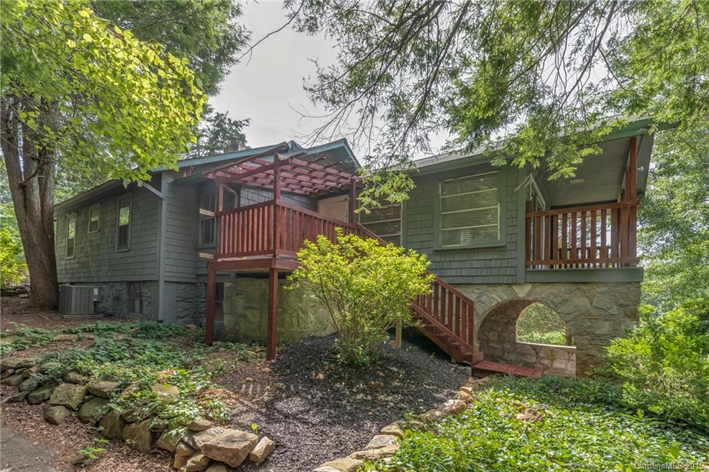 265 Carson Street Tryon, NC 28782 - Photo 2 of 28 a house view with a garden space