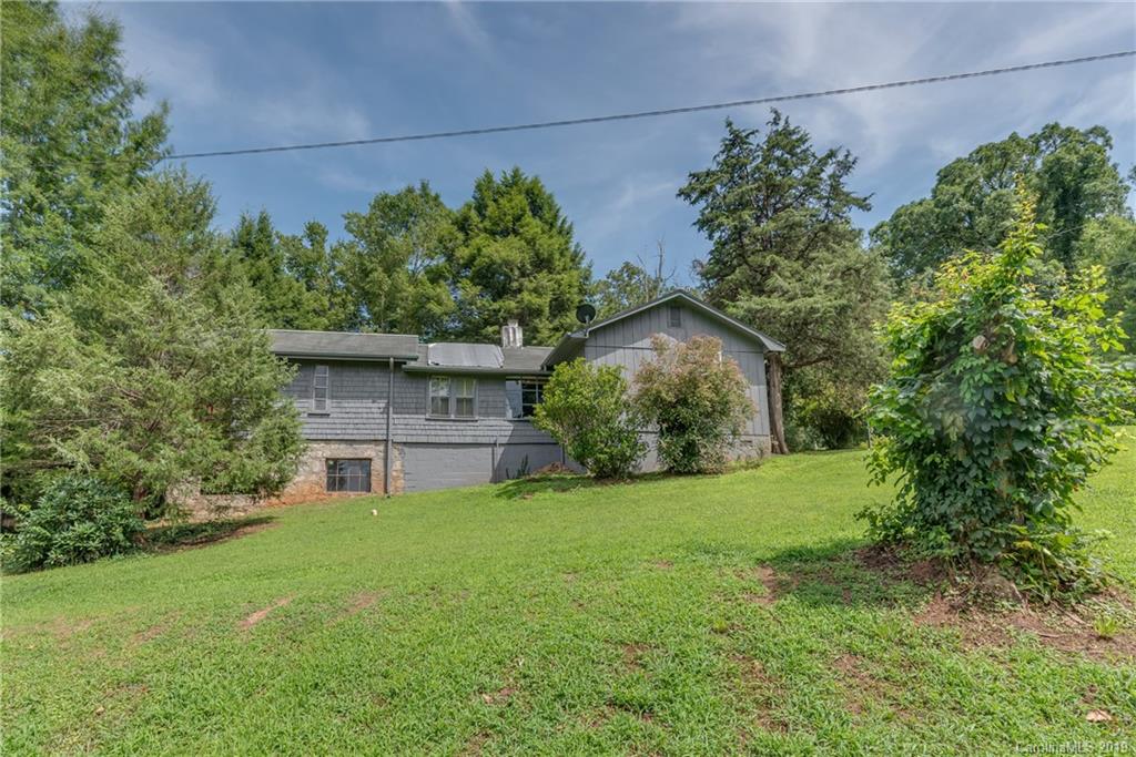 265 Carson Street Tryon, NC 28782 - Photo 20 of 28 a front view of a house with garden