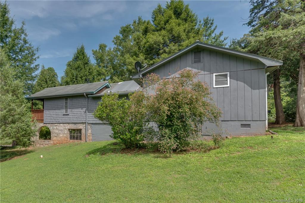 265 Carson Street Tryon, NC 28782 - Photo 21 of 28 a view of a house with a yard