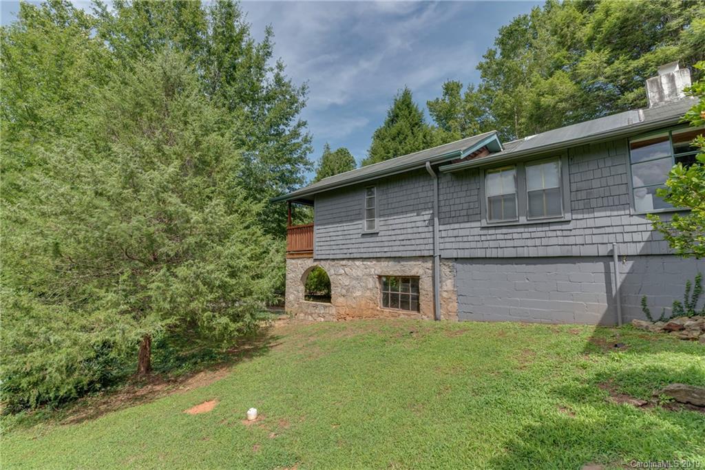 265 Carson Street Tryon, NC 28782 - Photo 22 of 28 a view of a house with a yard