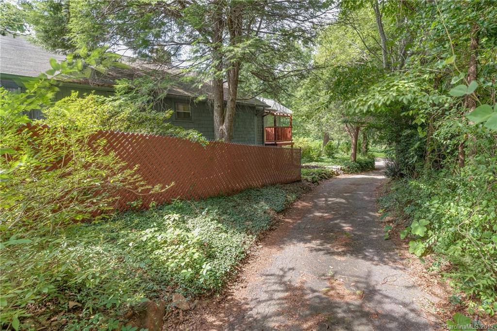 265 Carson Street Tryon, NC 28782 - Photo 24 of 28 a backyard of a house with lots of green space