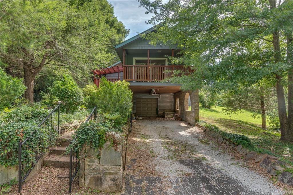 265 Carson Street Tryon, NC 28782 - Photo 26 of 28 a front view of house with yard and trees