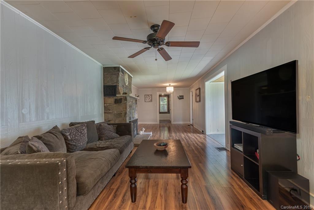 265 Carson Street Tryon, NC 28782 - Photo 6 of 28 a living room with furniture and a flat screen tv