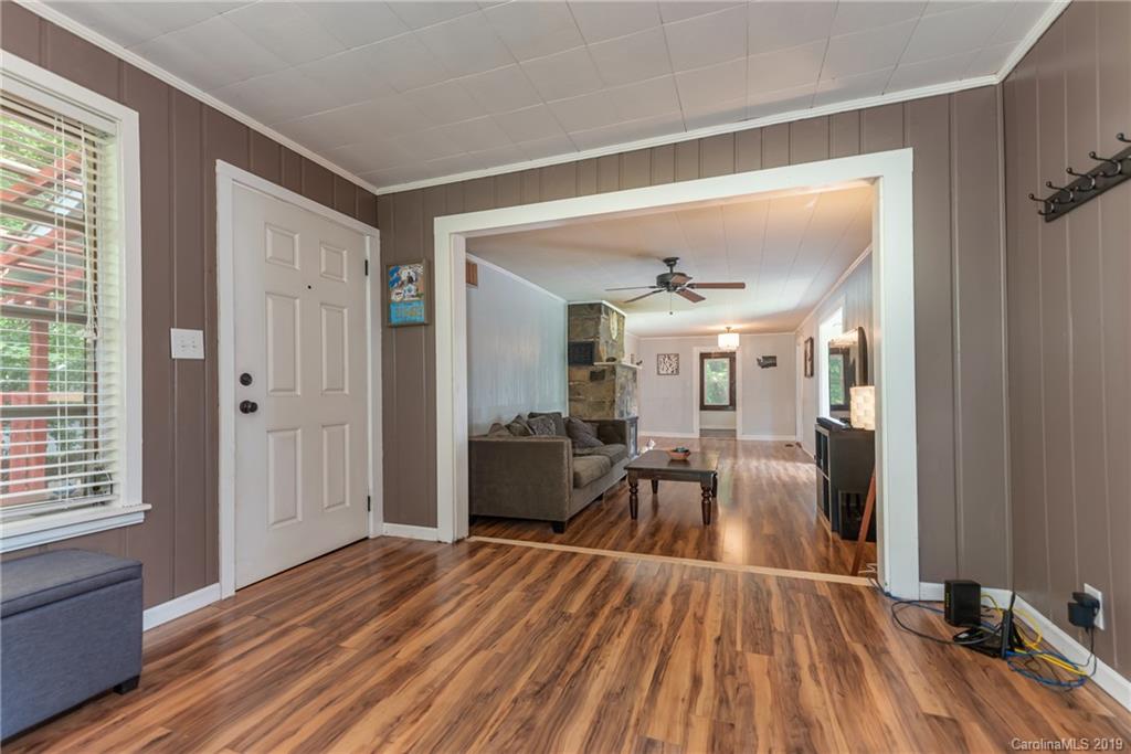 265 Carson Street Tryon, NC 28782 - Photo 9 of 28 a view of a livingroom with furniture and wooden floor