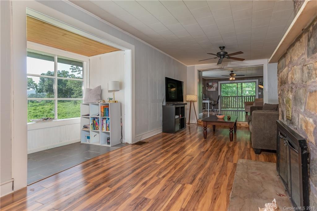 265 Carson Street Tryon, NC 28782 - Photo 10 of 28 a view of a livingroom with furniture window and wooden floor