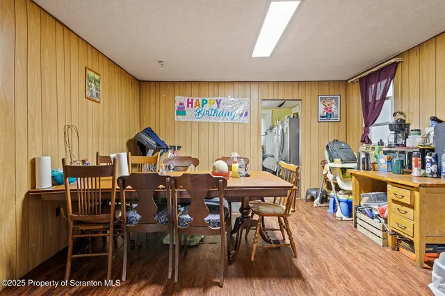 a view of a dining room with furniture and window