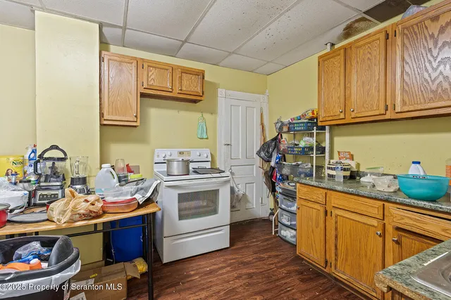 a kitchen with a sink cabinets and appliances