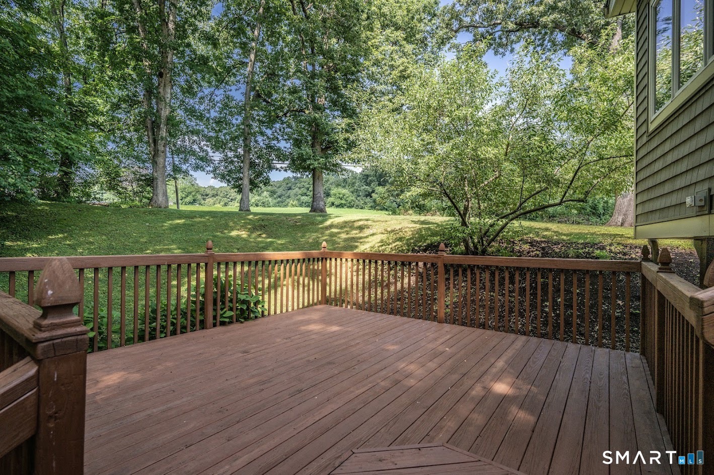 12 Ross Road Middlefield, CT 06481 - Photo 25 of 30 Deck directly off the family room offers a peaceful spot to relax, dine outdoors and enjoy the surrounding greenery and scenic views.