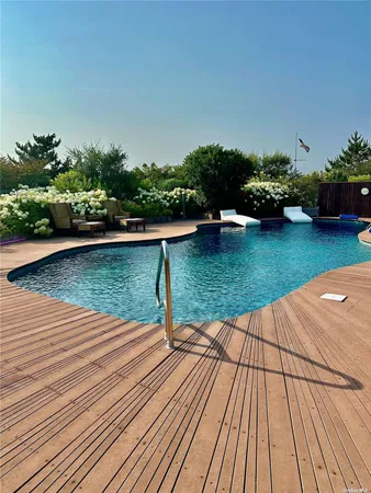 a view of a lake with wooden floor