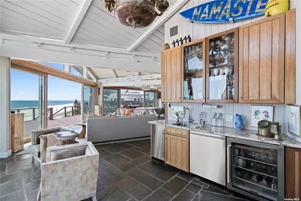a kitchen with sink a stove and cabinets