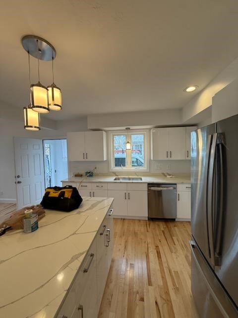 10 Idalla Avenue Worcester, MA 01606 - Photo 4 of 6 a kitchen with a sink a counter space appliances and cabinets