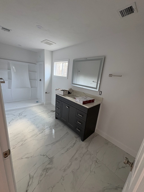 10 Idalla Avenue Worcester, MA 01606 - Photo 6 of 6 a room with a stove and cabinets