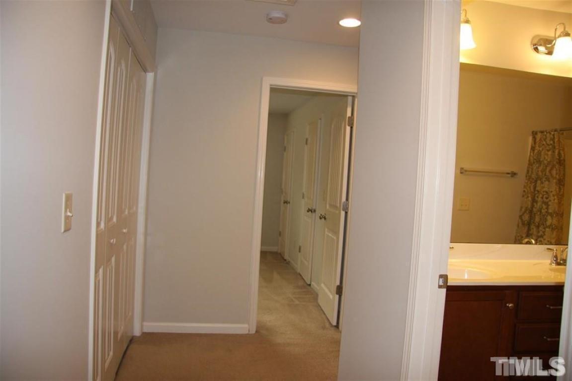 139 Skyros Loop Cary, NC 27519 - Photo 19 of 30 a view of bathroom with a sink and mirror