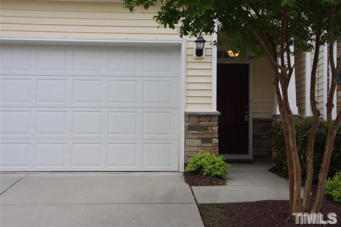 139 Skyros Loop Cary, NC 27519 - Photo 2 of 30 a couple of potted plants in front of door