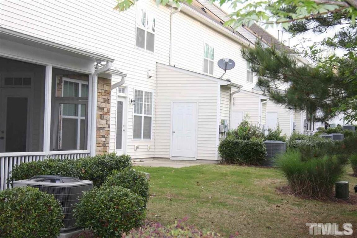 139 Skyros Loop Cary, NC 27519 - Photo 28 of 30 a view of a backyard with plants and large trees