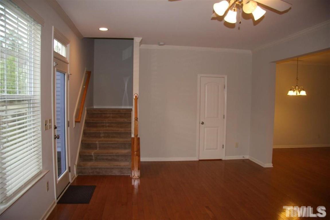 139 Skyros Loop Cary, NC 27519 - Photo 10 of 30 wooden floor in an empty room with a window