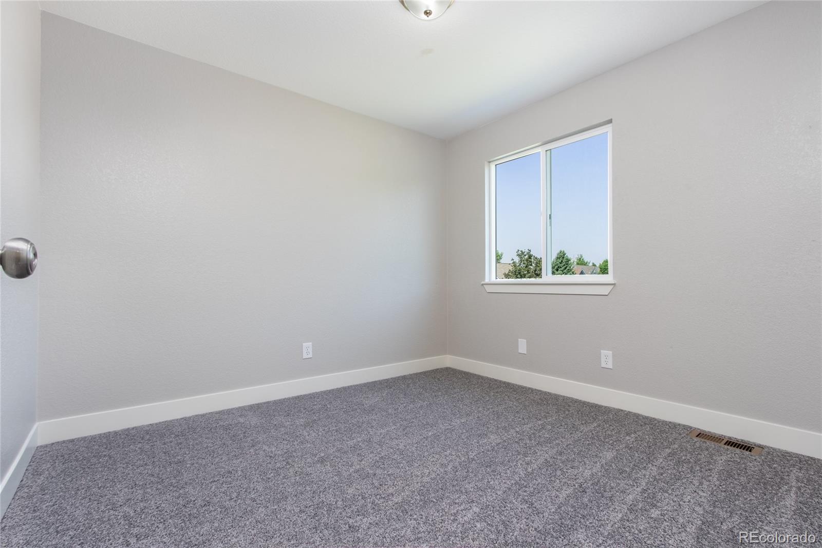 1589 Spring Water Way Highlands Ranch, CO 80129 - Photo 24 of 40 a view of an empty room with a window