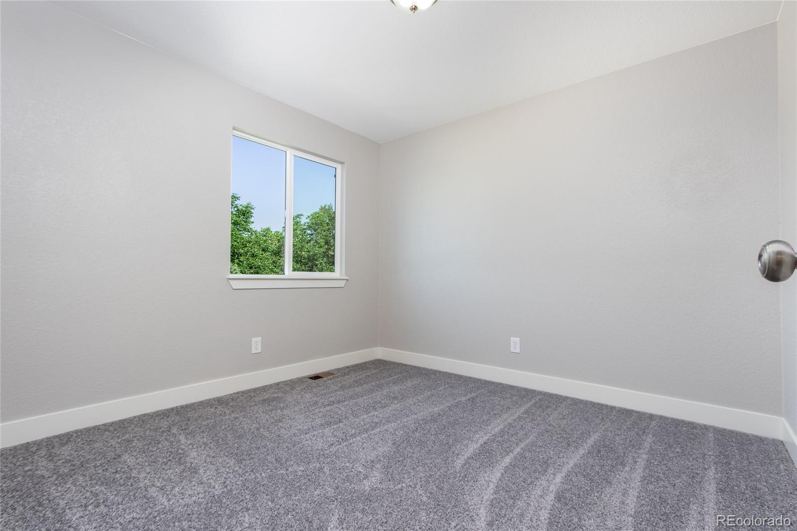 1589 Spring Water Way Highlands Ranch, CO 80129 - Photo 27 of 40 an empty room with a window