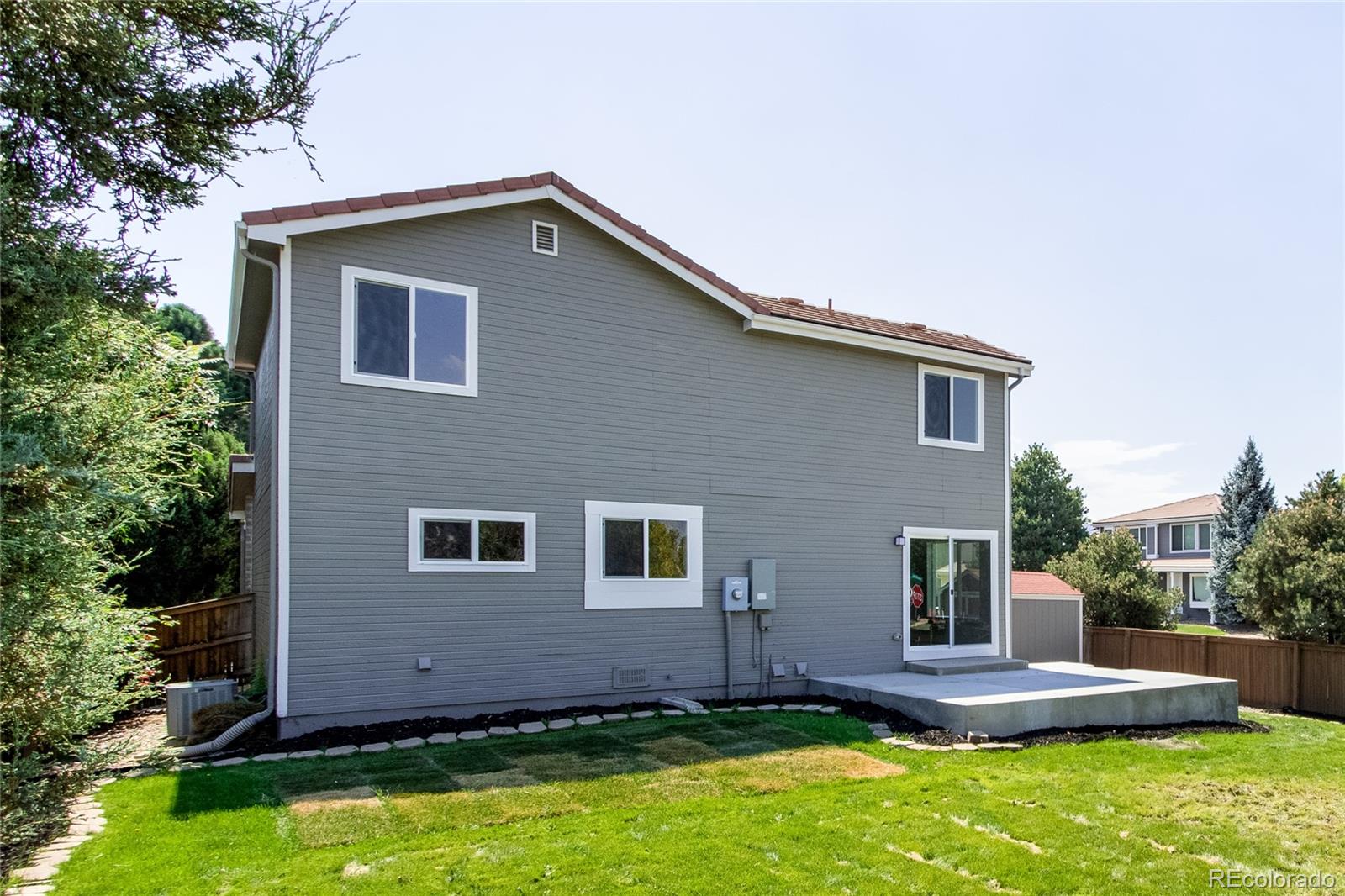 1589 Spring Water Way Highlands Ranch, CO 80129 - Photo 35 of 40 a front view of a house with a yard