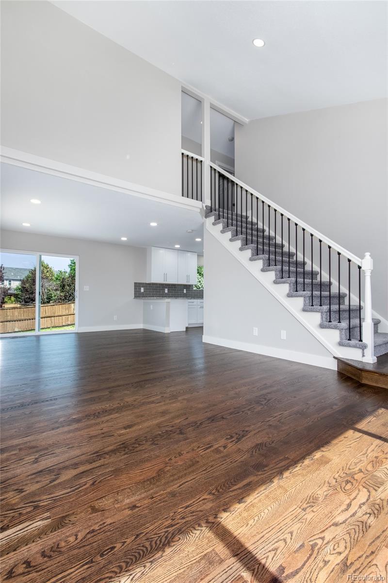 1589 Spring Water Way Highlands Ranch, CO 80129 - Photo 5 of 40 a view of empty room with wooden floor and windows