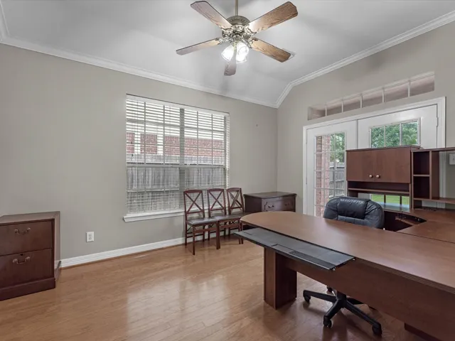 a work room with furniture and a window