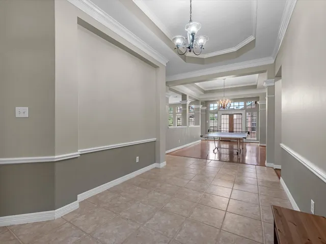 a view of an empty room with a kitchen
