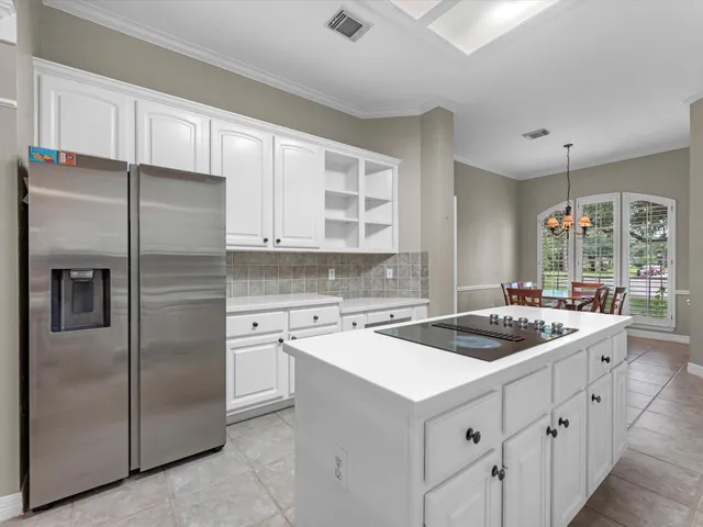 a kitchen with a sink stove and refrigerator