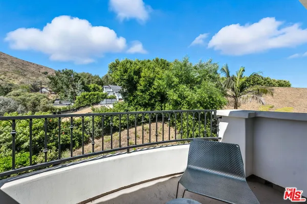 a view of a balcony with lake view