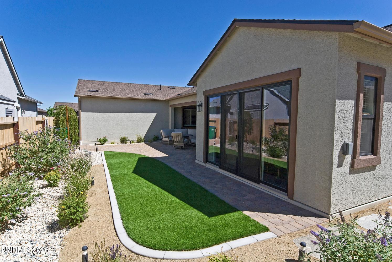 2332 Hammer Falls Drive Reno, NV 89521 - Photo 38 of 57 a view of a house with a backyard porch and sitting area