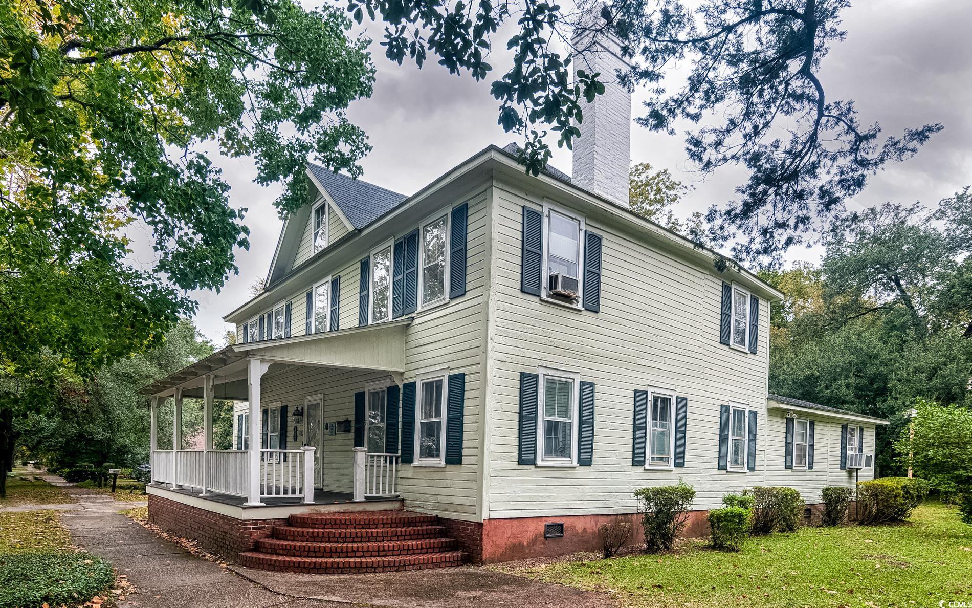 1010 Highmarket Street Georgetown, SC 29440 - Photo 2 of 32 Back of house featuring crawl space, a porch, a chimney, and cooling unit