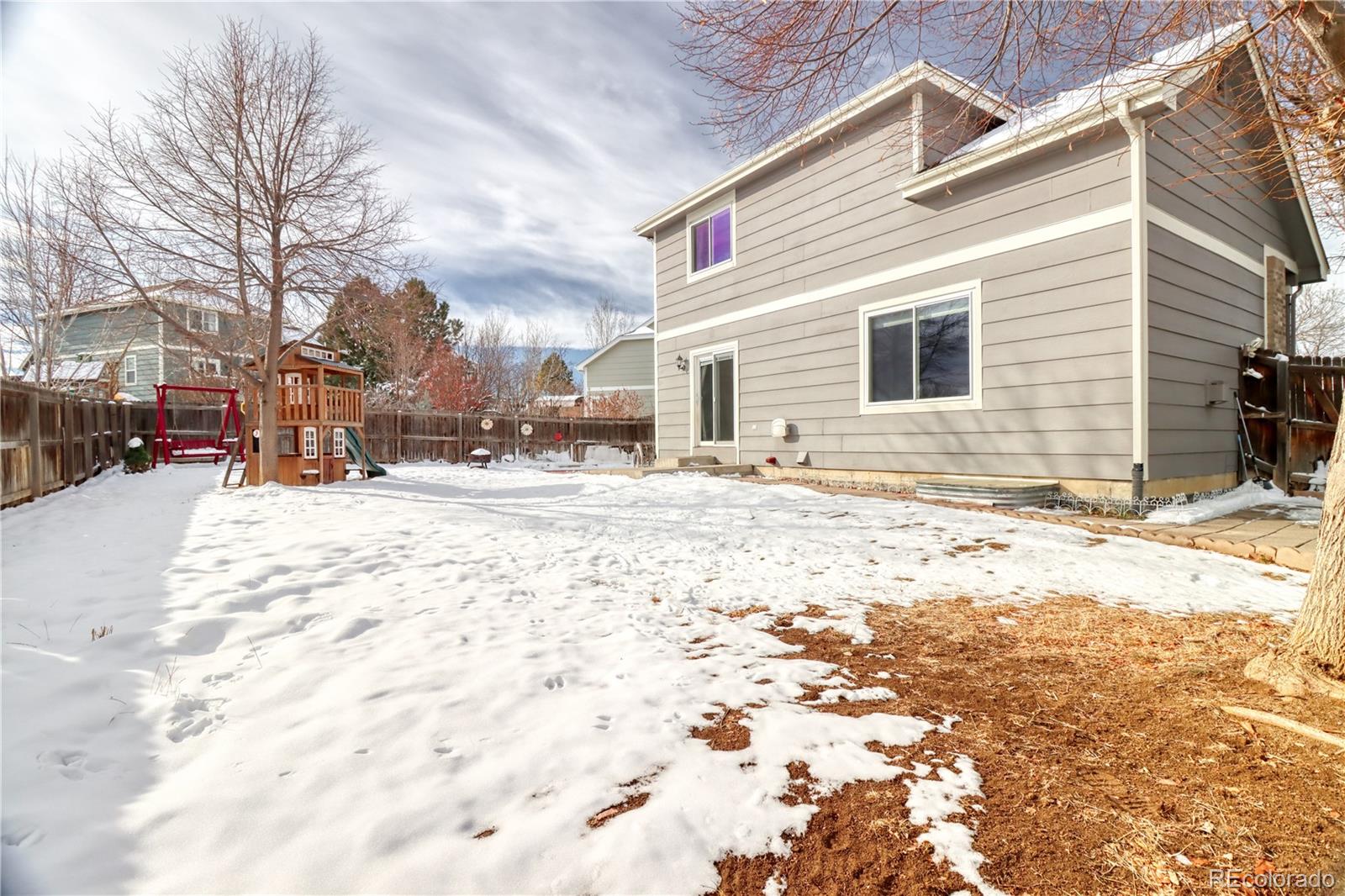 3819 South Rome Way Aurora, CO 80018 - Photo 23 of 25 a view of street with large trees