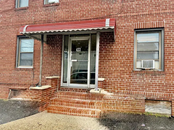 a view of a brick house with a window