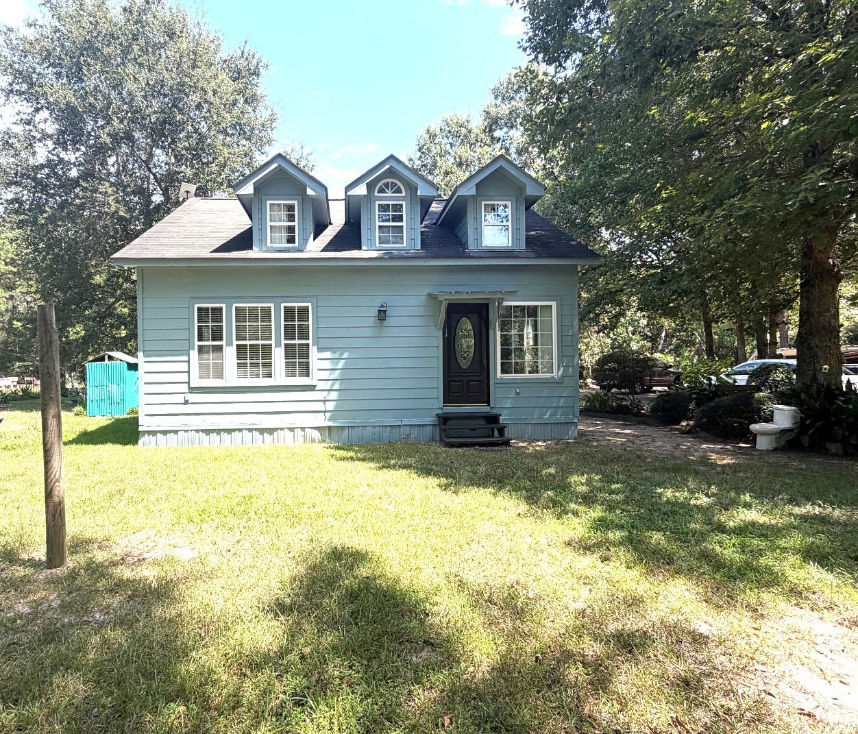 3080 Lee Turner Road Cleveland, TX 77328 - Photo 1 of 48 Full of character and nestled beneath a canopy of mature trees, this charming home offers a picturesque setting with plenty of room to enjoy the outdoors.