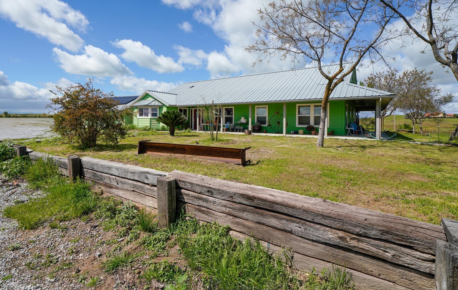 37491 Verde Avenue Madera, CA 93636 - Photo 20 of 66 a view of a house with a yard